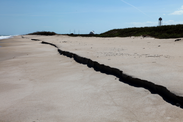 Hurricane Sandy flattened protective dunes between Launchpads 39A and 39B, resulting in millions of dollars of shoreline reparations. Photo: NASA.